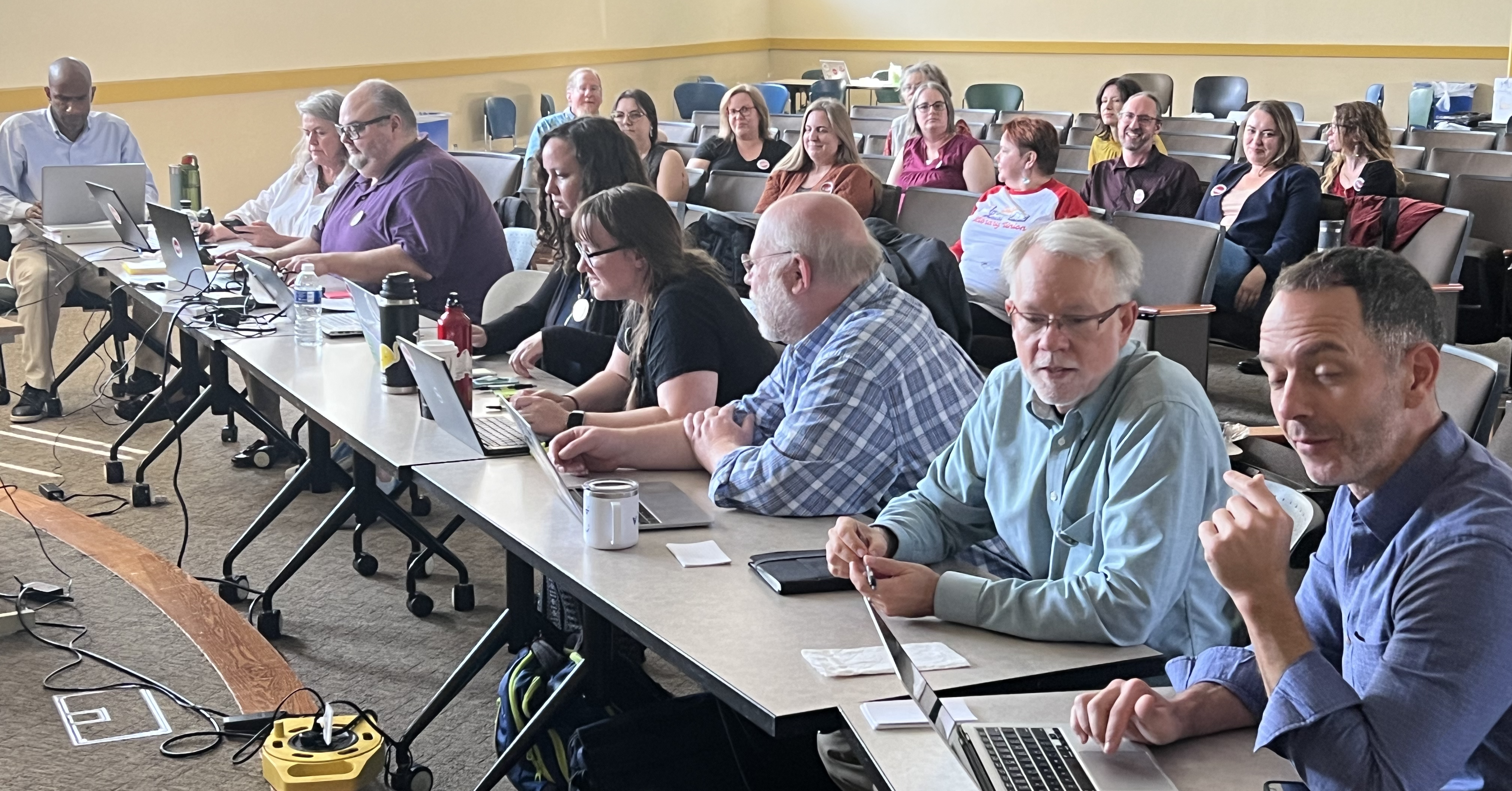 FAM-L Bargaining Team negotiates in front of their observers.