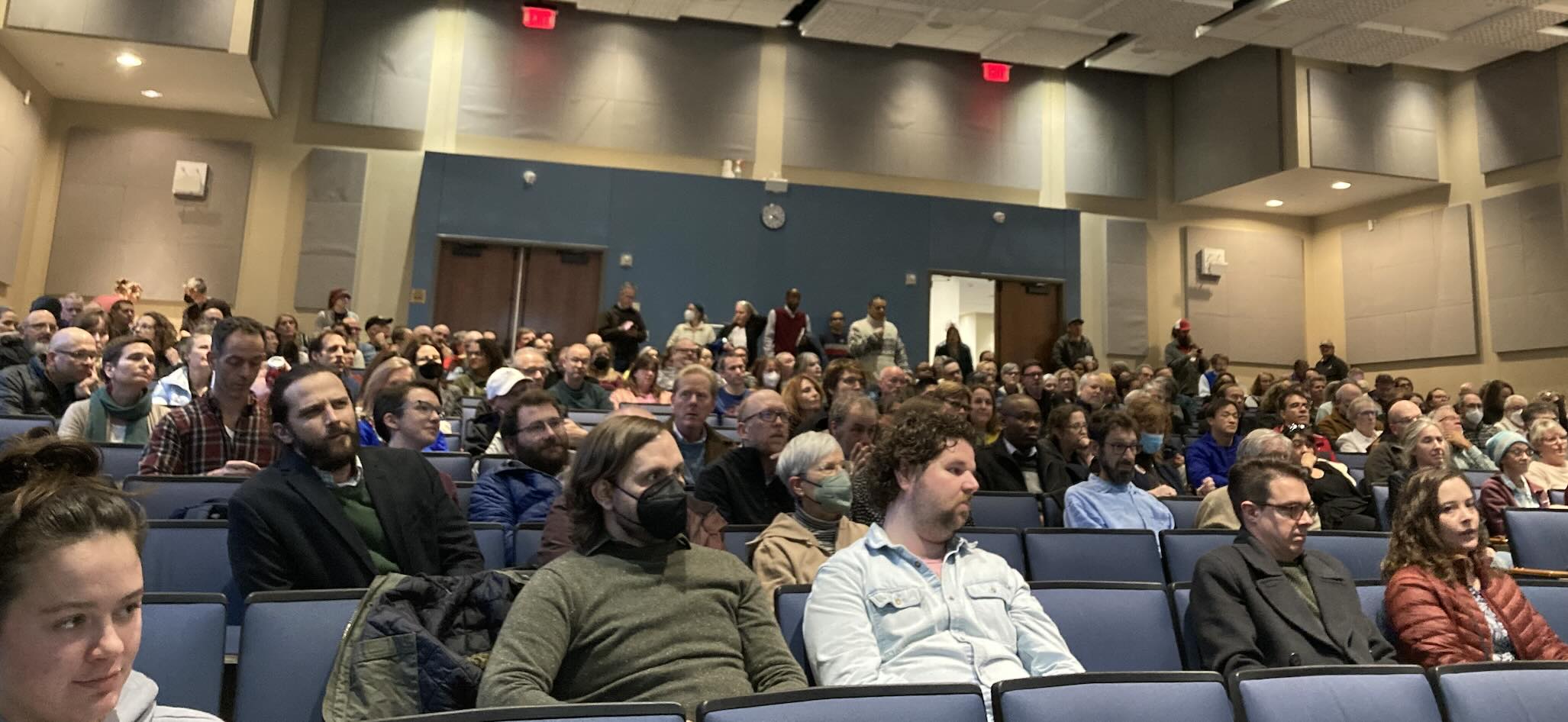 A large crowd of faculty faces in 102 Benton on Thursday, November 30, during Faculty Assembly