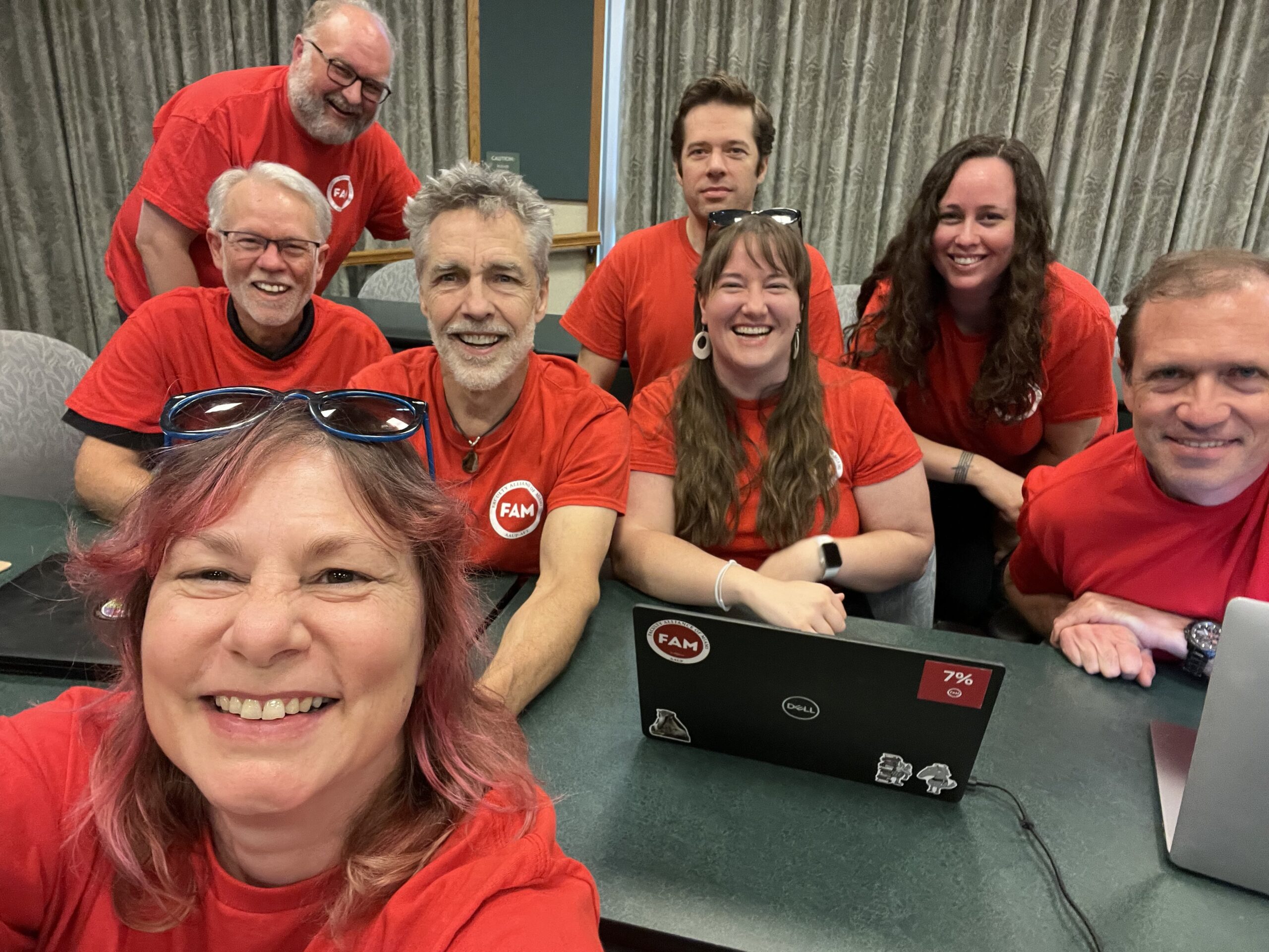 Smiling selfie of NT dressed in FAM tees