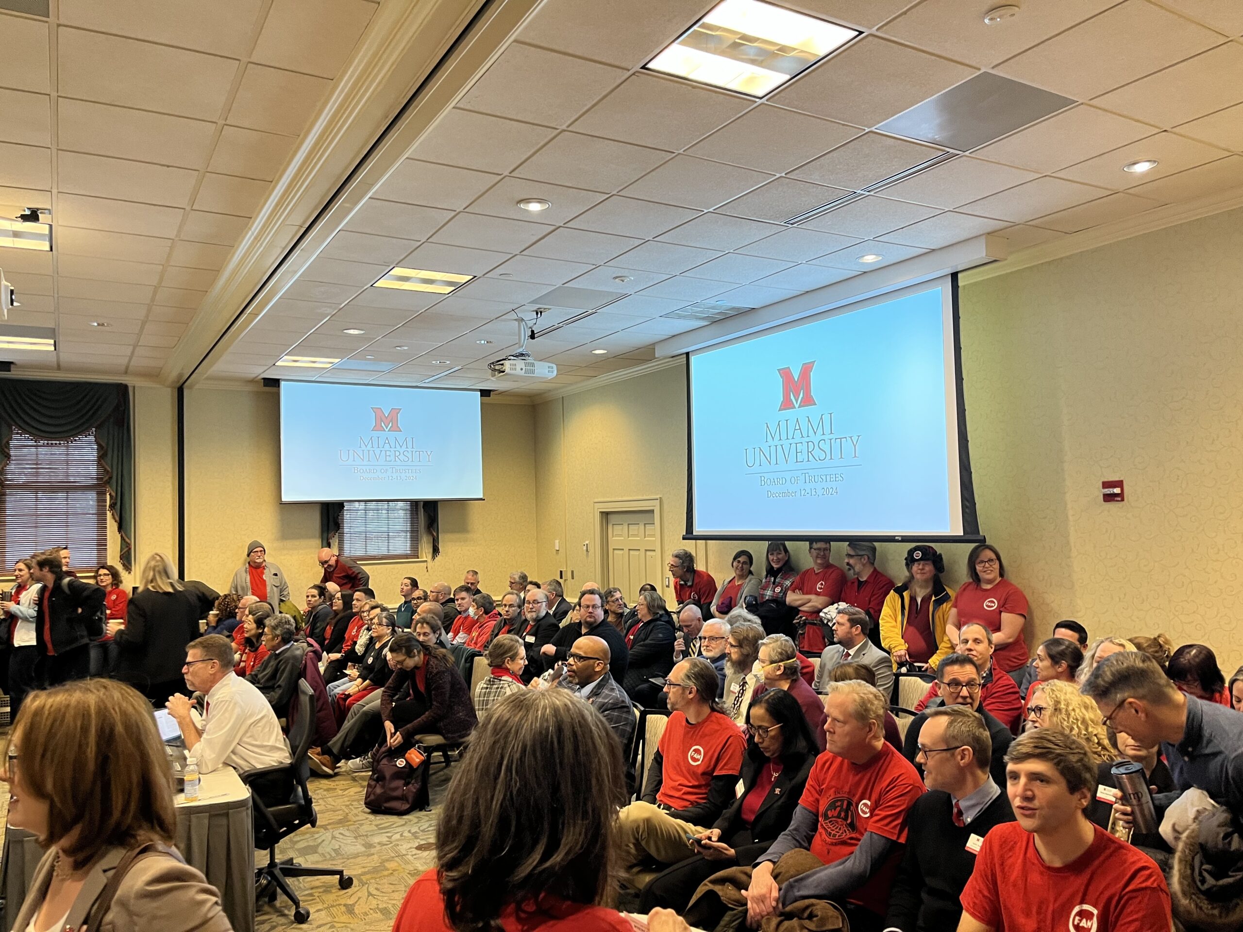 100+ faculty and librarians in red shirts packed the Board of Trustees meeting this morning on our 471st day of negotiations with the University.