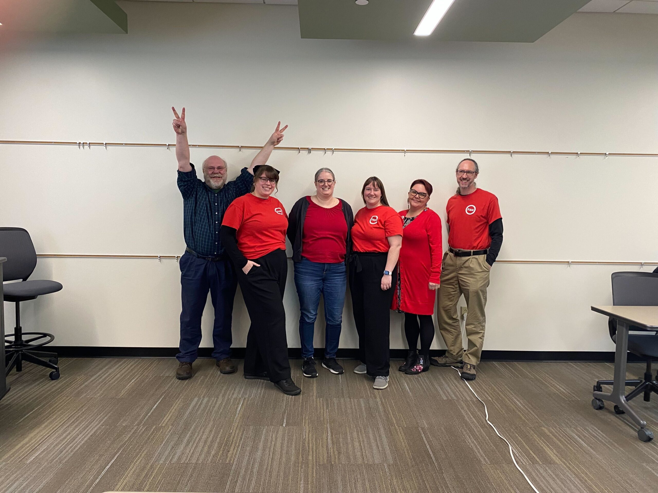 Your FAM Negotiating Team, smiling and powerful in red!